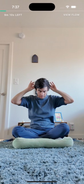 A fullscreen guided exercise video with the time remaining shown at the top.